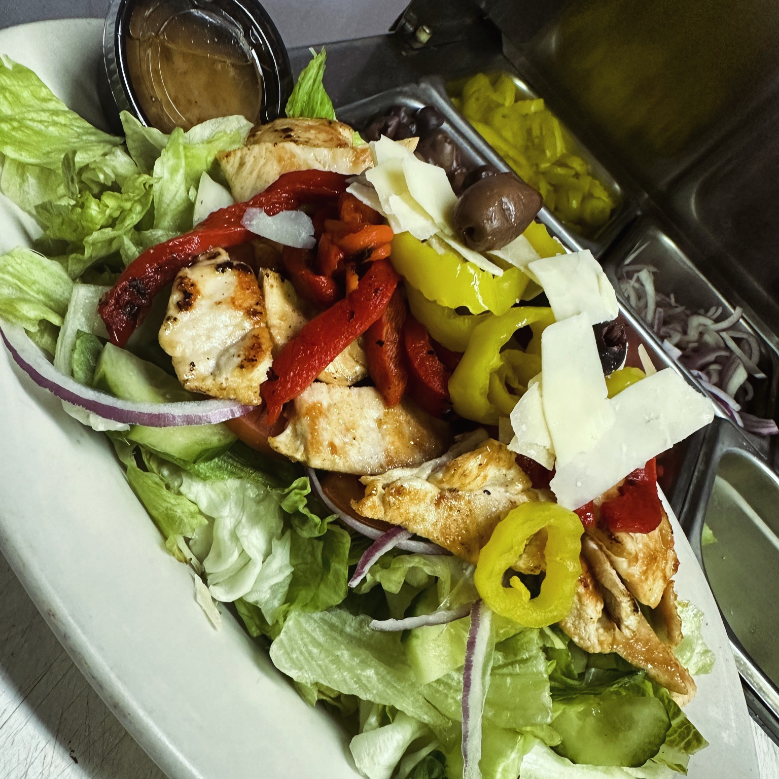 Dell’Ovo’s grilled chicken salad with peppers, olives, and shaved cheese